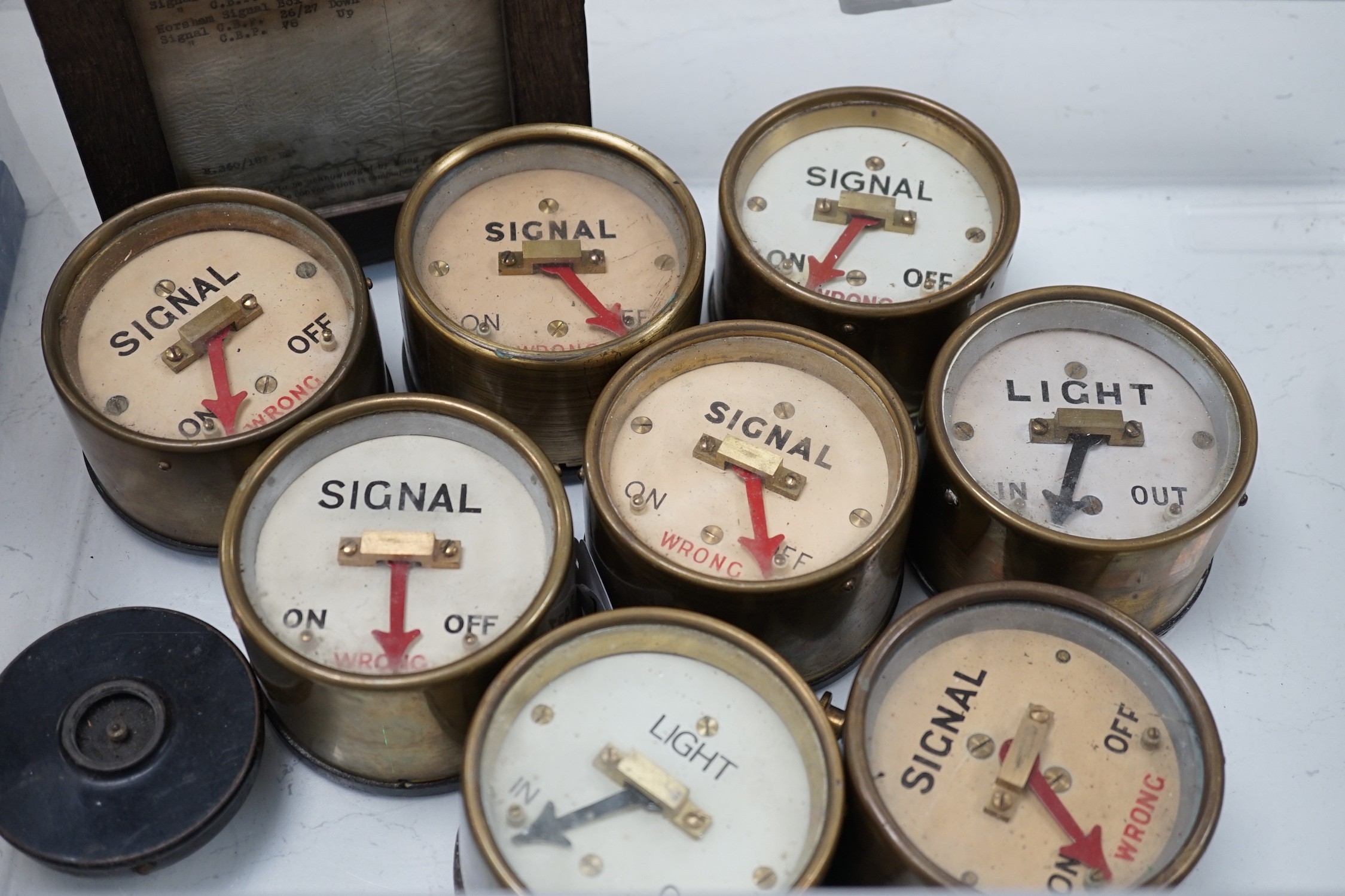 Eight Sykes type brass cased signal box repeaters